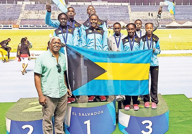 NACAC president Mike Sands with members of the Bahamas' mixed under-15 bronze medalists and under-13 gold medalists in El Salvador.