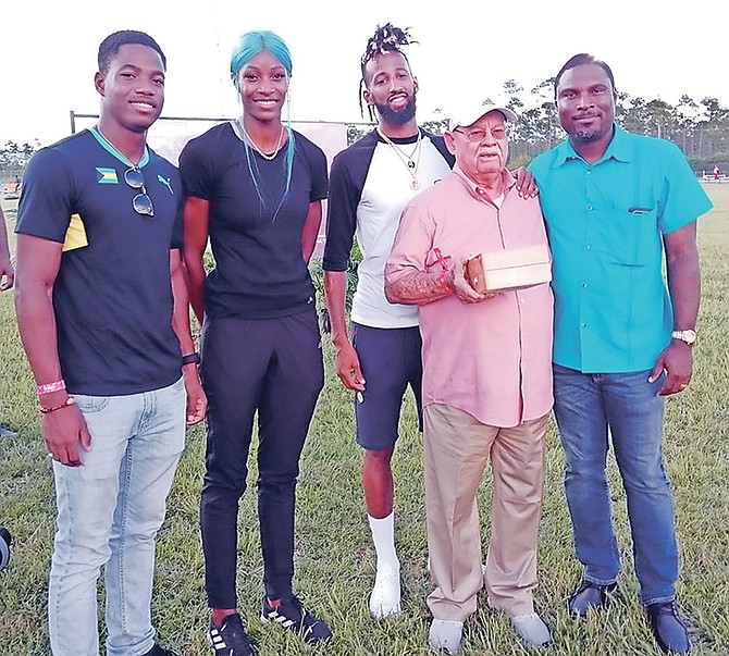 Coach Ronald Cartwright is flanked by Shaun Miller, Shaunae Miller-Uibo, Jamal Wilson and BAAA president Drumeco Archer.