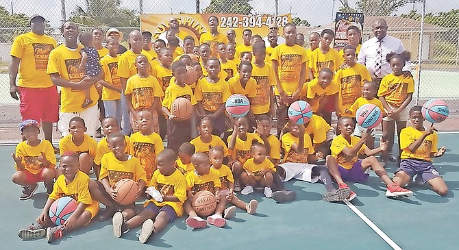 Campers gather for a group photo with instructors at the Mario Bowleg Basketball Camp.