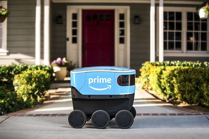 A self-driving delivery robot that Amazon is calling Scout. Amazon is expanding the use of its self-driving delivery robots to a second state. (Amazon via AP, File)