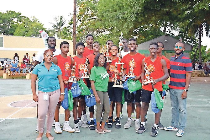 The Lucayans, the under-19 champions, collect their awards from BTC and Coca-Cola.