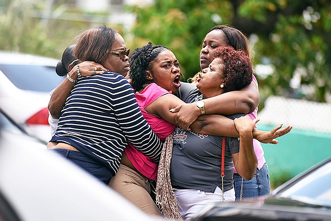Families clash outside of court as Able Seaman Jevon Seymour is arraigned. Photo: Shawn Hanna/Tribune staff