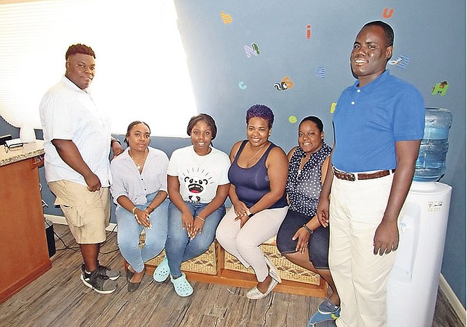 Carla Gibson, third from right, with staff of the Renee Oneil Center for Child Development and Research.