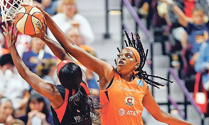 Connecticut Sun centre Jonquel Jones blocks a shot attempt from Las Vegas Aces guard Jackie Young on Friday.
(Sean D Elliot/The Day via AP)