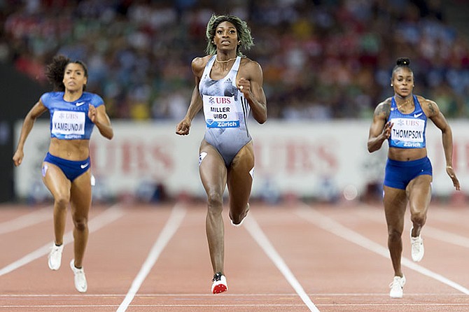 Shaunae Miller-Uibo on her way to winning the women's 200m (Ennio Leanza/Keystone via AP)