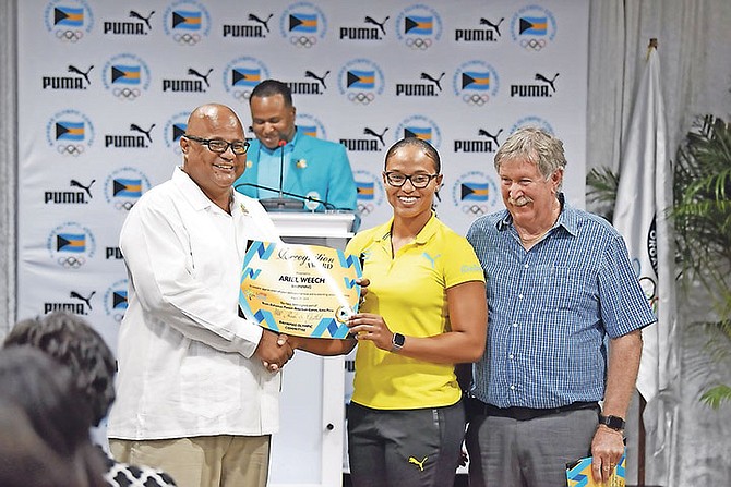 The Bahamas Olympic Committee hosted an awards ceremony yesterday at the Thomas A. Robinson Stadium for Team Bahamas who competed in the 2019 Panam Games. Ariel Weech is pictured receiving her award. Photo: Shawn Hanna/Tribune Staff