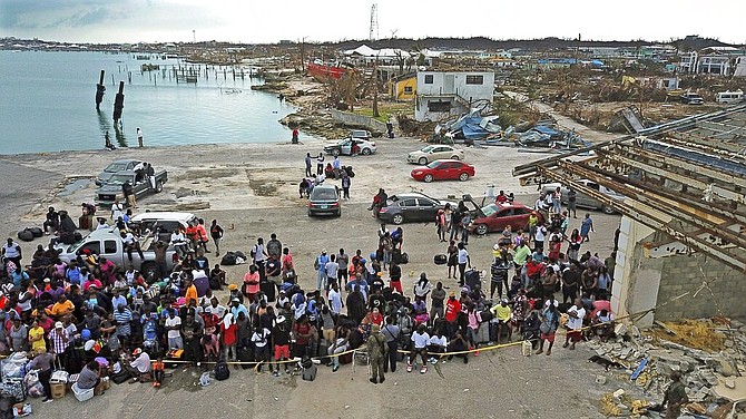 Evacuees gather at Marsh Harbour Port in Abaco, Friday. (Al Diaz/Miami Herald via AP)