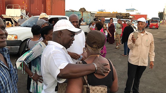 PLP Leader Philip ‘Brave’ Davis greets evacuees at Potter’s Cay Dock.