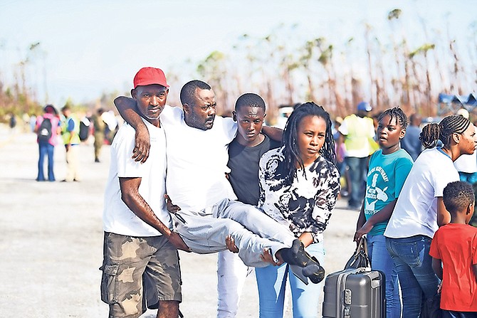 Hundreds of Hurricane Dorian survivors gathered at Treasure Cay International Airport in attempts to evacuate the island. Photo: Shawn Hanna/Tribune Staff