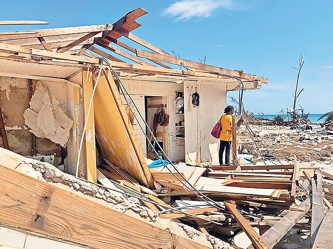 Former MP and Senator Pleasant Bridgewater surveys the damage to the home where she lived with her mother and sister.