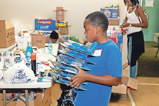 Volunteers at NPCC organising and packing donated goods for hurricane relief. Photos: Donavan McIntosh