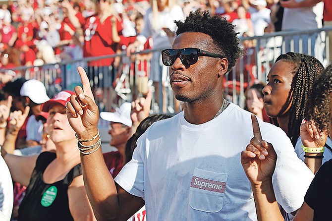 Buddy Hield stands for the alma mater before an NCAA college football game between South Dakota and Oklahoma on Saturday in Norman, Oklahoma.

(AP Photo/Sue Ogrocki)