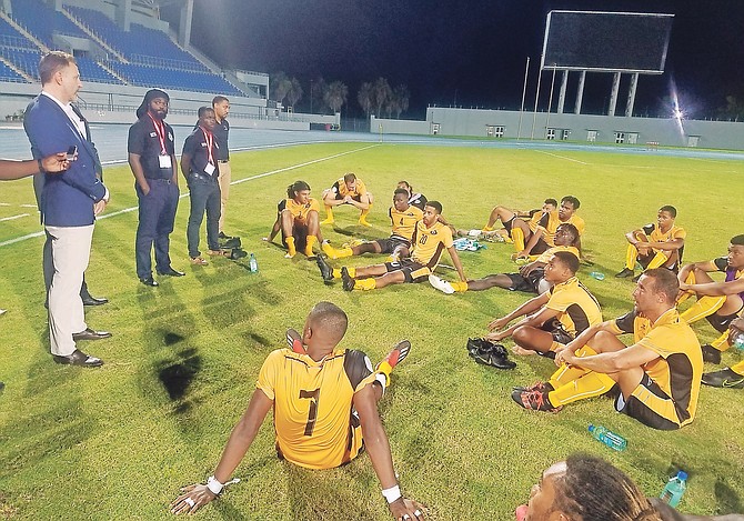 CONCACAF general secretary Phillipe Moggio addresses the Bahamas men's national soccer team after their 2-1 victory over Bonaire.