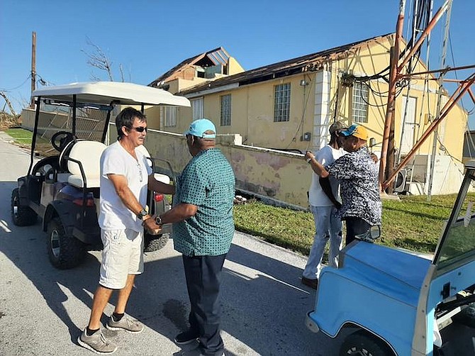 Former Prime Ministers Hubert Ingraham and Perry Christie greet people on Abaco.