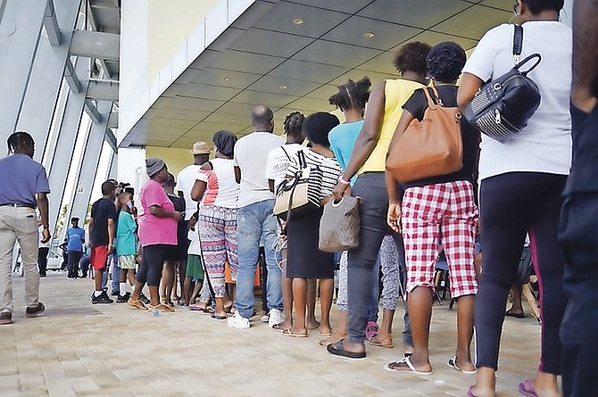 Parents and students queuing at the national stadium. Photos: Terrel W Carey Sr/Tribune Staff