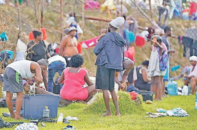 Residents from The Mudd cleaning clothes outside the Bahamas Government Complex.

Photo: Terrel W. Carey Sr/Tribune Staff