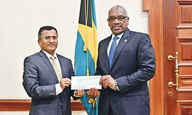 India High Commissioner M Sevala Naik presented a $1m donation to Prime Minister Dr Hubert Minnis for storm relief yesterday.