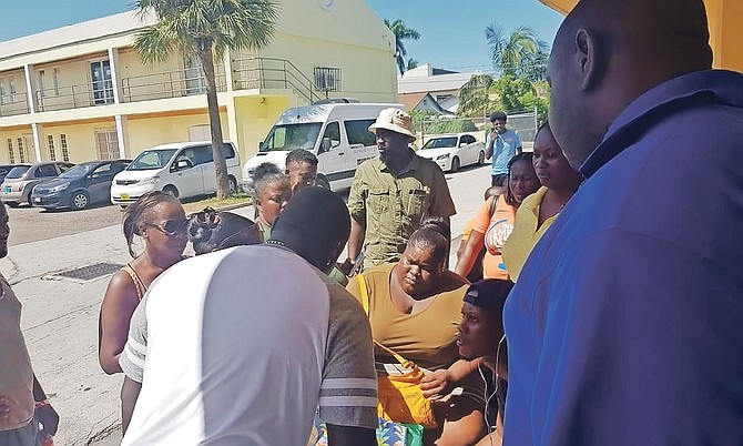 People were left waiting for hours yesterday at both the Department of Social Services and the Registrar General’s Department, as government services struggled to cope with the number of people in need of help after Hurricane Dorian. Among those waiting was Alesha McNeill, pictured seated centre, who lost the roof of her home in Fortune Bay, Grand Bahama, who had obtained a copy of her police record and a job application form, who said: “I just need clothes because I lost everything in the storm. I need a job. I just need help.”  Photo: Rashad Rolle/Tribune Staff