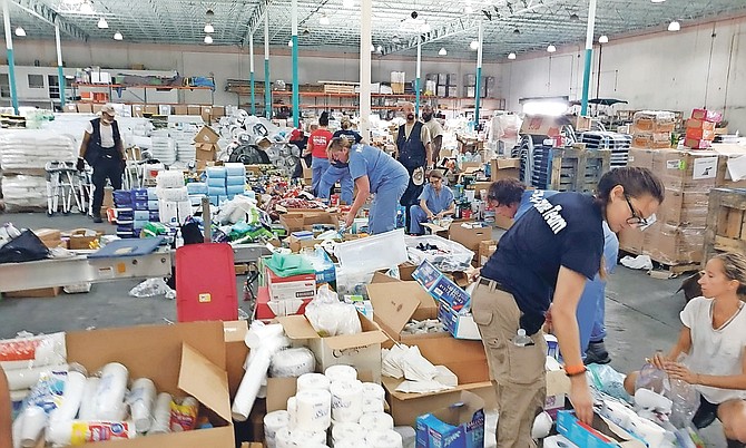 Volunteers at Freeport Ship Services Warehouse on Saturday. Photo: Lisa Davis/BIS