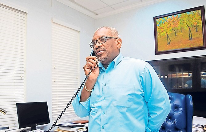 Prime Minister Dr Hubert Minnis speaking to former US President Bill Clinton.