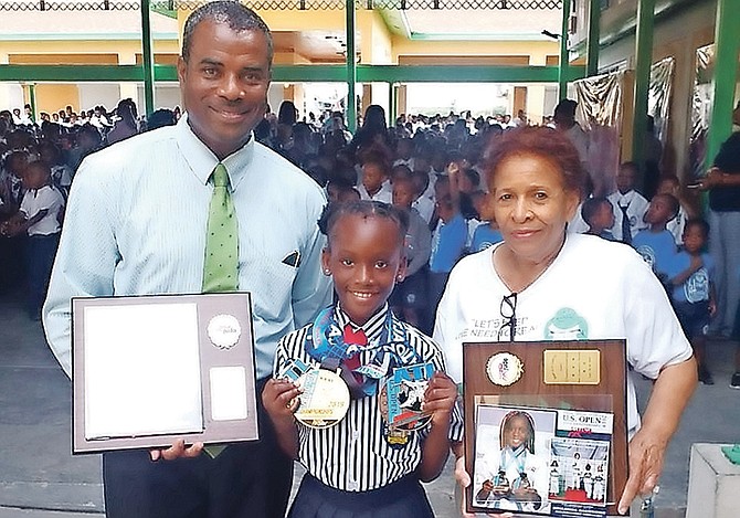 Keilesha Saunders, centre, with her awards.