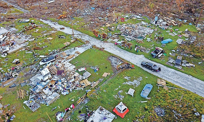 In this picture from September 8th, a road cuts through the rubble of homes that belong to the same family, destroyed by Hurricane Dorian in Rocky Creek, East End, Grand Bahama. Photo: Ramon Espinosa/AP