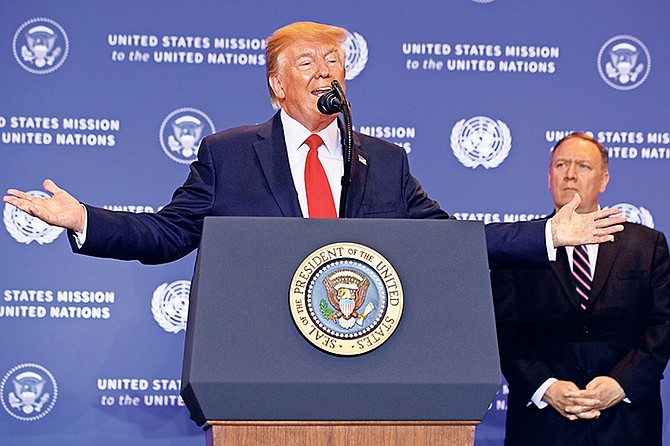 Secretary of State Mike Pompeo listens as President Donald Trump speaks during a news conference during the United Nations General Assembly yesterday. Photo: Evan Vucci/AP