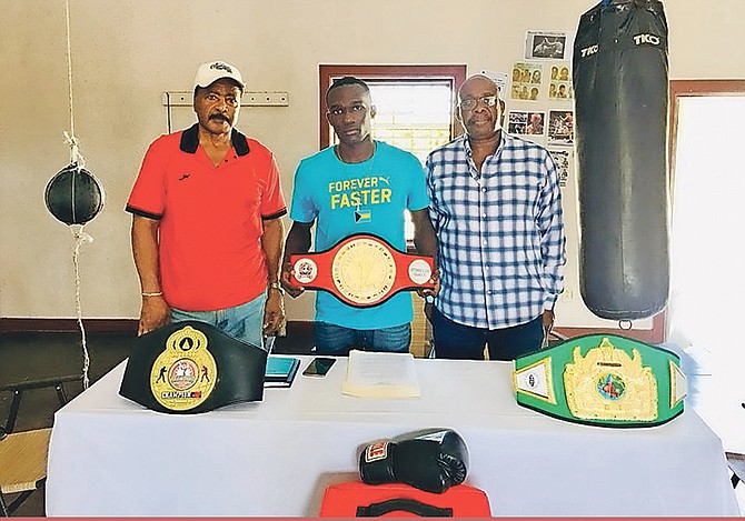 SHOWN (l-r) are Sherwin Johnson, vice president of Boxing Federation of the Bahamas, boxer Lennox Boyce and Vincent Strachan, president of the federation.