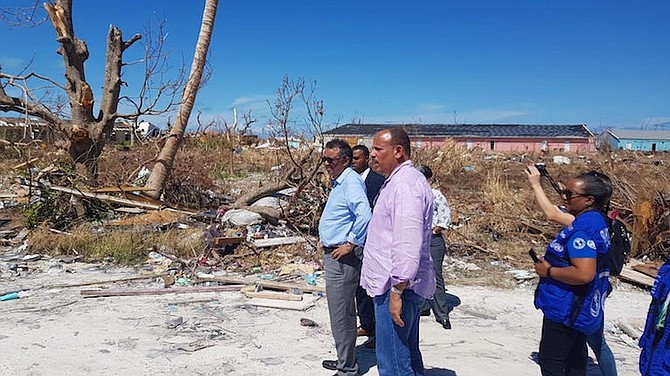 Minister of Health Dr Duane Sands on the ground in Abaco Friday with the Director General of the World Health Organisation (WHO) Dr Tedros Adhanom Ghebreyesus and other representatives.