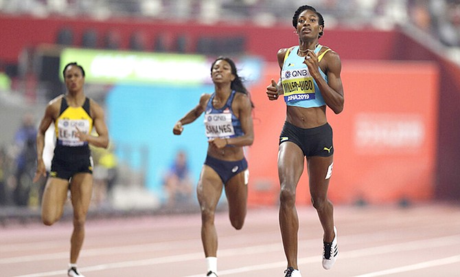 Shaunae Miller-Uibo runs in the 400 metre heats at the World Athletics Championships in Doha, Qatar, Monday. (AP Photo/Petr David Josek)