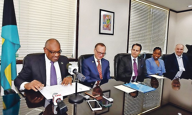 Prime Minister Dr Hubert Minnis at the signing of the heads of agreement with Carnival for a $100m cruise port in Grand Bahama.