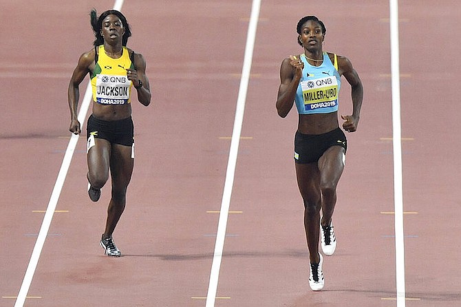 Shaunae Miller-Uibo and Shericka Jackson, of Jamaica, compete in the women's 400 metre semifinals at the World Athletics Championships in Doha, Qatar, Tuesday. (AP Photo/Martin Meissner)