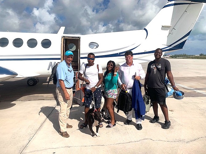 Doug takes this Abaco family and their dog to Nassau on his plane just after Hurricane Dorian.