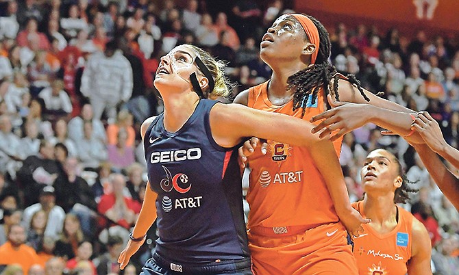 Washington Mystics’ Elena Delle Donne, left, and Connecticut Sun’s Jonquel Jones battle for position under the basket during the first half in Game 3 of the WNBA Finals on Sunday in Uncasville, Connecticut.

(AP Photos/Jessica Hill)