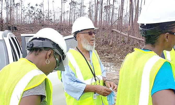 Human rights and environmental activist Joseph Darville and Rashema Ingraham of Save the Bays and Waterkeepers Bahamas tour Equinor spill site in East End on Tuesday.