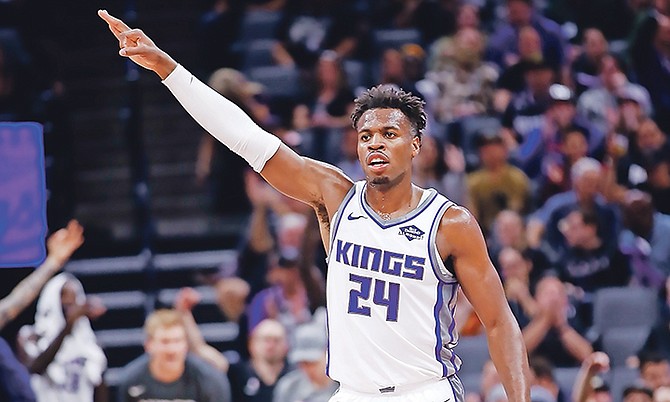 Sacramento Kings guard Buddy Hield celebrates after teammate Bogdan Bogdanovic scored a three-point basket during the first quarter of a preseason game against the Phoenix Suns in Sacramento, California, on October 10.

(AP Photo/Rich Pedroncelli)