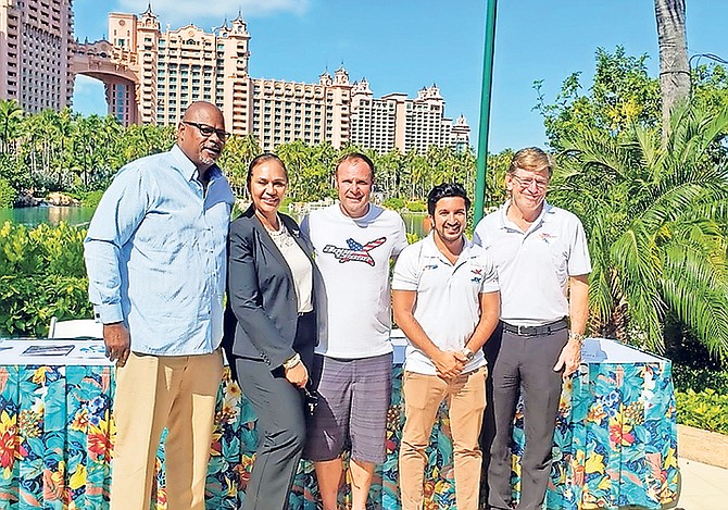 SHOWN (l-r) are Ed Fields, senior vice president of public affairs at Atlantis, Joy Jibrilu, director general in the Ministry of Tourism and Aviation, Brian Baldwin - Aqua X world champion, Azam Rangoonwala, CEO of P1 AquaX, and Fred Lounsberry, CEO of the Nassau Paradise Island Promotion Board.