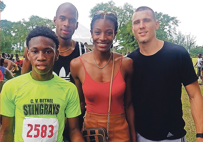 Nathan Duncan, far left, shares a moment with Steven Gardiner, Shaunae Miller-Uibo and Maicel Uibo at the Silver Lightning Cross Country Championships on Saturday.