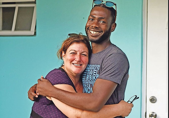 The Ranfurly Home hosted a ceremony yesterday to open their first official transitional home. Alexandra Maillis-Lynch, Ranfurly Homes for Children President, is pictured with 18-year-old Lickson Presume – the first official resident at the home. Photos: Shawn Hanna/Tribune Staff