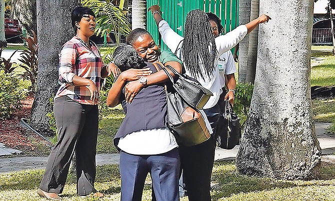 Teachers celebrate their win. Photo: Terrel W. Carey Sr/Tribune Staff