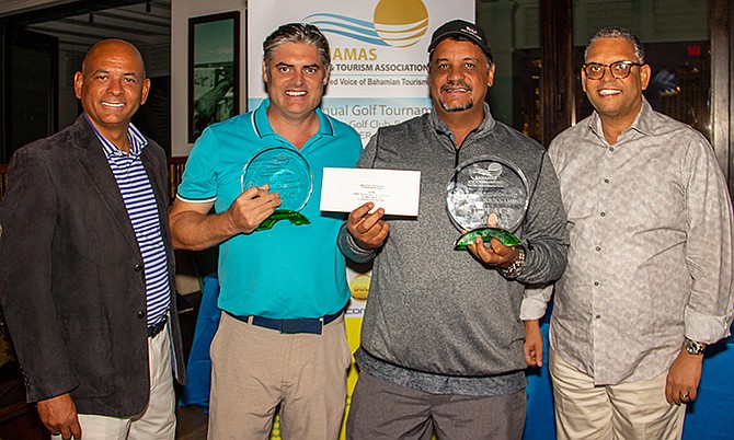 SHOWN (l-r) are Carlton Russell, president of the BHTA, 1st place winners Neale Jones and Tony Aranha and Robert “Sandy” Sands, senior vice president of the BHTA.