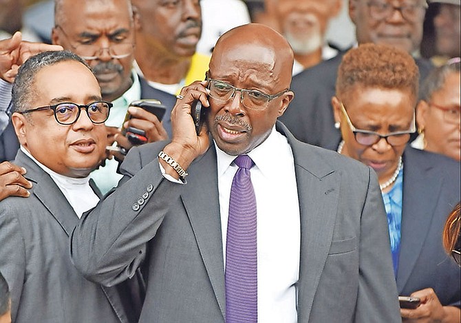 An emotional Shane Gibson along with his lawyers and supporters after being acquitted on all counts of bribery yesterday.
Photo: Shawn Hanna/Tribune Staff