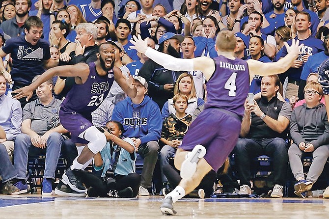 Stephen F Austin forward Nathan Bain (23) celebrates his game-winning basket against Duke in overtime of an NCAA college basketball game in Durham, North Carolina, on Tuesday.

Photo: Gerry Broome/AP
