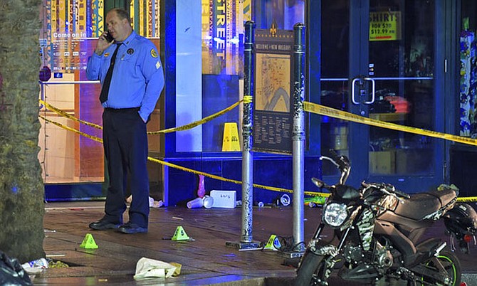 New Orleans police investigate a shooting on Sunday where 10 people are understood to have been wounded. (Max Becherer/The Times-Picayune/The New Orleans Advocate via AP)