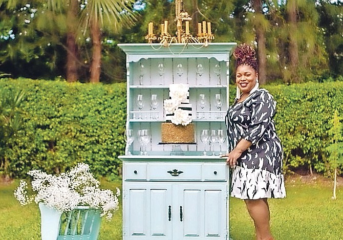 Gina Sands shows off some of her vintage pieces available for rental. 
(Photos/Rashad Smith/RS Photography)