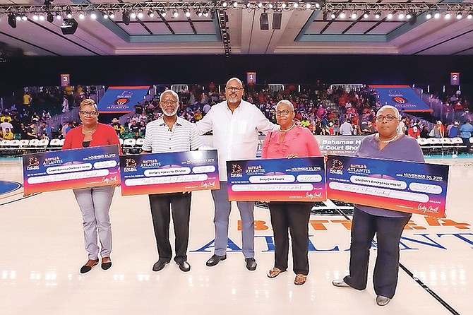 GENEROUS DONATION – Representatives from three children’s homes and a school for children with special needs received a donation from Atlantis, Paradise Island during the recent Bad Boy Mowers Battle 4 Atlantis basketball tournament. Seen from left to right are Sheila Smith, administrator of the Grand Bahama Children’s Home, Alexander Roberts, administrator at The Ranfurly Homes for Children, Ed Fields, Senior VP of Public Affairs at Atlantis, Vernelle Carey, teacher at Every Child Counts in Abaco, and Sabrina Smith, administrator at The Bahamas Children’s Emergency Hostel.
                                                                                                                                                                                                                                                                                       Photos by Tim Aylen