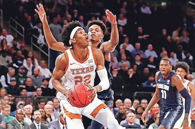 Georgetown forward Jamorko Pickett (1) defends Texas forward Kai Jones (22) during the first round of the 2K Empire Classic NCAA college basketball tournament on November 21 in New York.

(AP Photo/Kathy Willens)