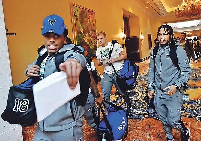TEAMS IN TOWN: Buffalo Bulls and Charlotte 49ers arrived at the Atlantis resort on Paradise Island Monday afternoon to kick off the sixth year of the Makers Wanted Bahamas Bowl, set for 2pm Friday, December 20 at the Thomas A Robinson National Stadium. Officials of the Bahamas Ministry of Tourism & Aviation will attend the event, televised in the United States on ESPN. Team members are pictured upon arrival. 
Photos/Kemuel Stubbs/BIS