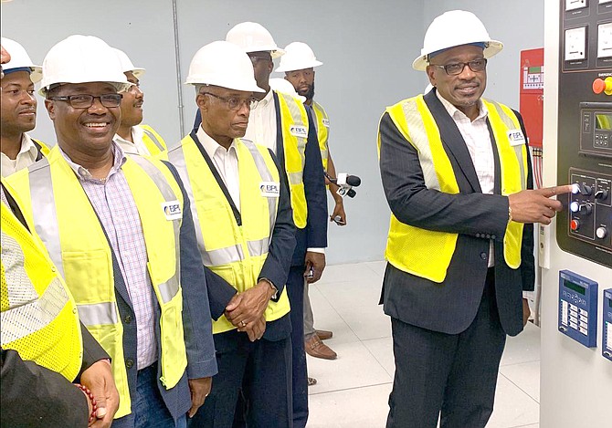 Prime Minister Dr Hubert Minnis (right) with officials at Bahamas Power and Light’s Station A electricity plant.