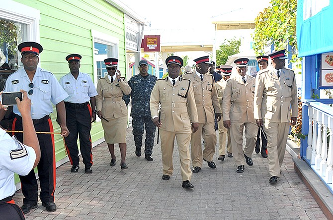 ACP Samuel Butler leads his officers during a walkabout in Grand Bahama during the Christmas holiday.
